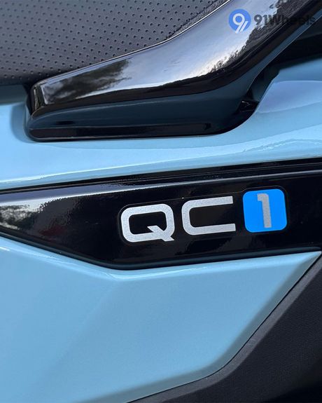 QC 1 Left Side Body Panel Badge