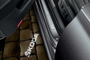 Superb 2022-2024 The Logo projected on the tramac welcomes you every time you get in the car