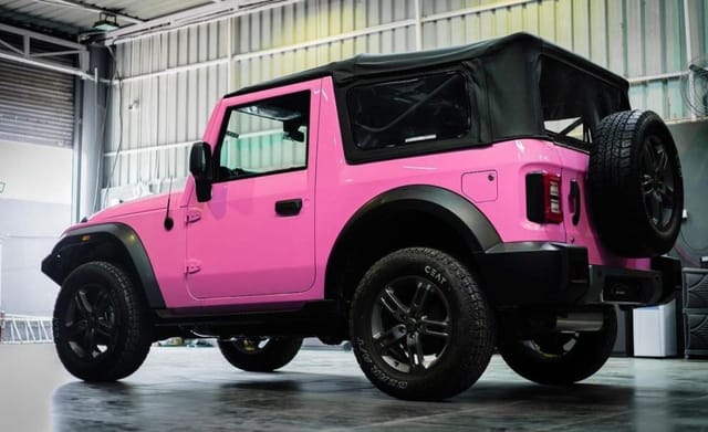 pink mahindra thar rear three quarters